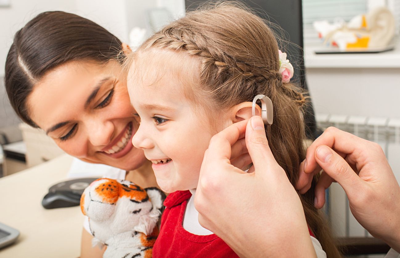Pediatric Child Hearing Aid Fitting child receiving hearing aids
