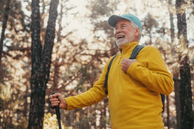 Cholesteatoma Symptoms man smiling on a hike in the woods